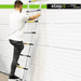 Man demonstrating the use of the Step-it™ telescopic ladder by Rackit Direct against a white wall, highlighting its sturdy rungs and easy-to-use design, perfect for both home use.